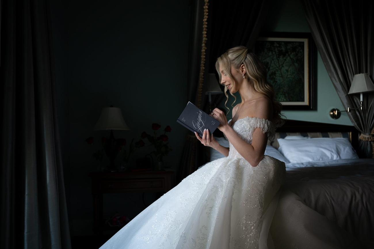 Bride reading a handwritten note before the ceremony
